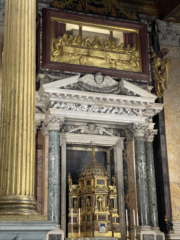 Above the tabernacle is a relic of the table used at the Last Supper (behind the gold bas relief)
